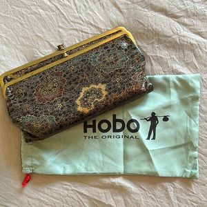 Hobo Lauren wallet with iridescent flower design.